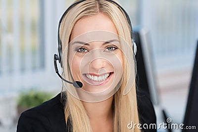 Smiling woman wearing a headset