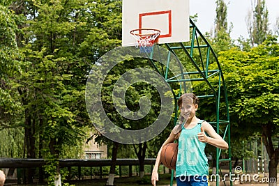 Smiling young female basketball player