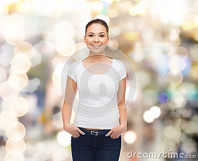 Smiling young woman in blank white t-shirt