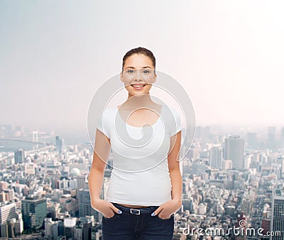 Smiling young woman in blank white t-shirt