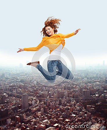 Smiling young woman jumping high in air