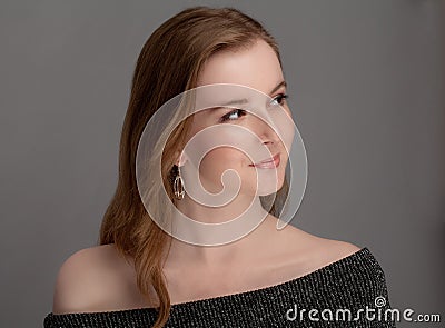 Smiling Young Woman in Off Shoulder Top