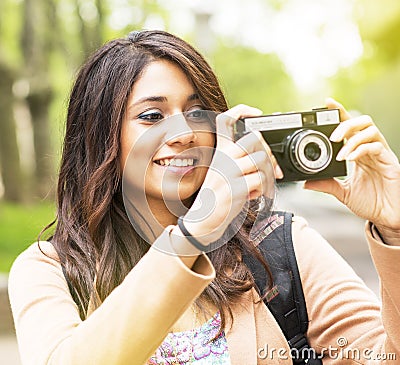 Smiling Young Woman Taking pictures.