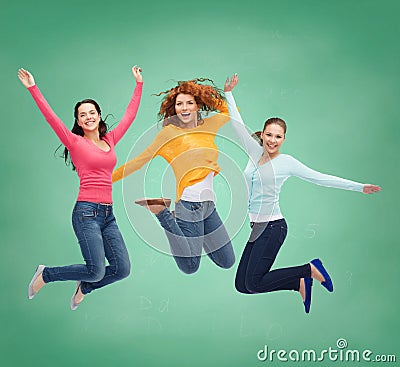 Smiling young women jumping in air