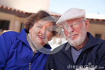 Smilng Senior Adult Couple Bundled Up Outdoors