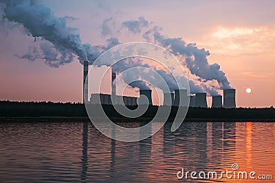 The smoke from the chimneys of a power plant