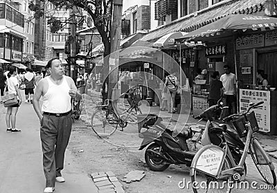 Smoking man at Chinese Food street in Wuhan, China