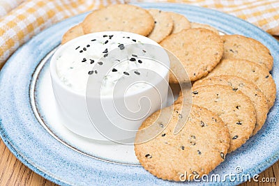 Snack - sauce with feta cheese and whole grain crackers