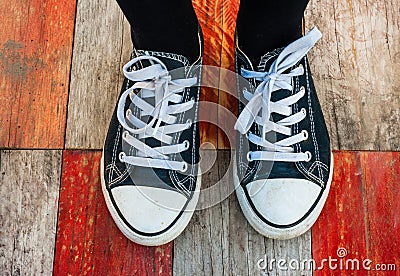 Sneakers on wood deck background