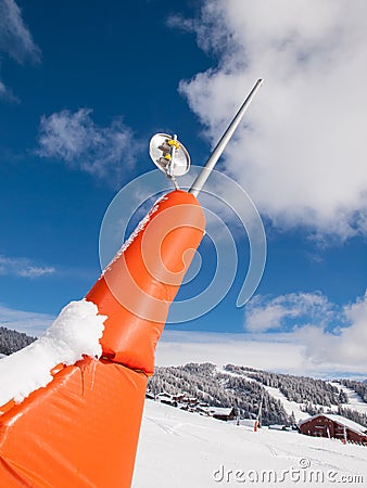 Snow canon in alpine landscape