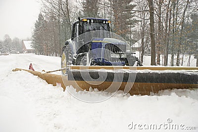 Snow plow cleaning street