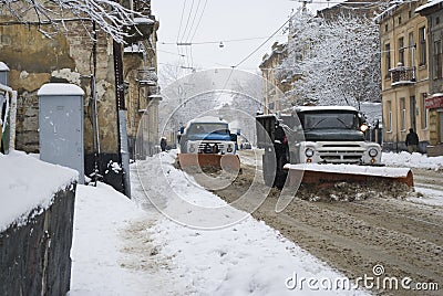 Snow-removal machine cleans the street of snow