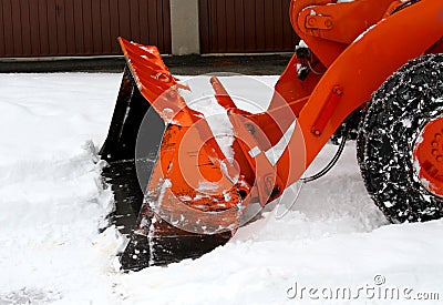 Snowplow at work to clear the road from the snow