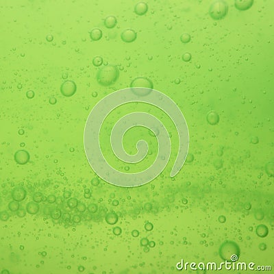 Soap bubbles green liquid background