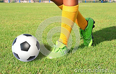 Soccer ball with foot of player kicking