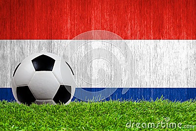 Soccer ball on grass with Netherlands flag