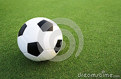 Soccer ball on green field