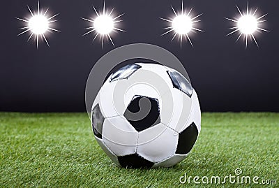 Soccer Ball On Green Pitch