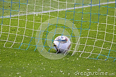 Soccer ball inside the net