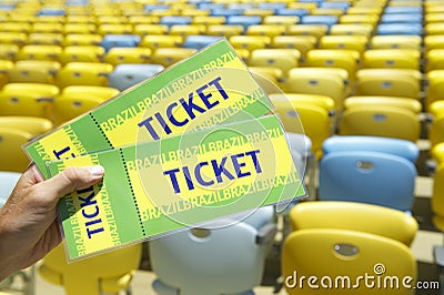 Soccer Fan Holding Two Brazil Tickets at the Stadium