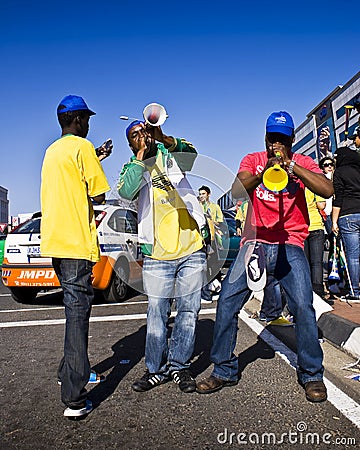Soccer Fans Blowing Vuvuzela Horn