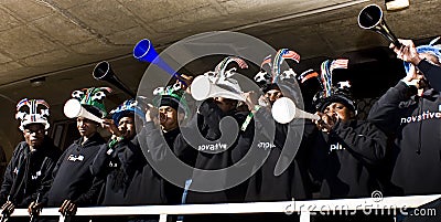 Soccer Fans in Makaraba blowing Vuvuzela