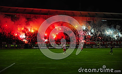 Soccer or football fans using pyrotechnics