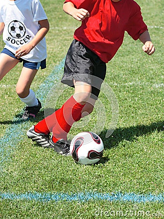 Soccer Player Chasing Ball
