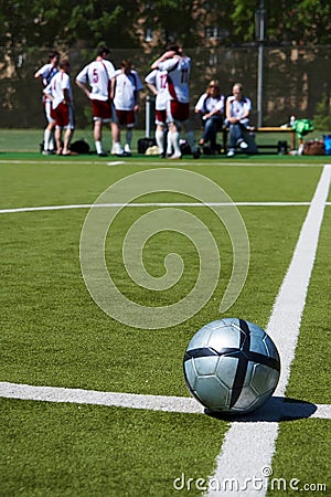 Soccer team resting on background