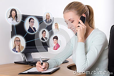 Social network concept - businesswoman talking on the phone in o