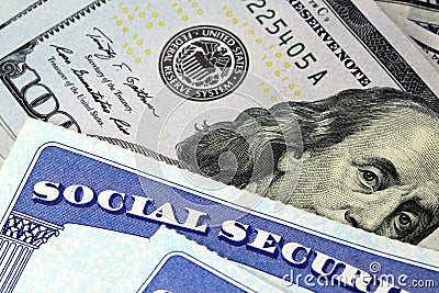 Social security card and US currency one hundred dollar bill