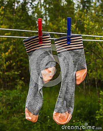 Socks hanging on the rope for drying clothes