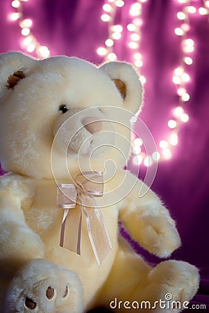 Soft teddy bear with bokeh lights