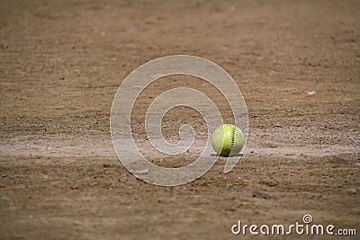 Softball in dirt