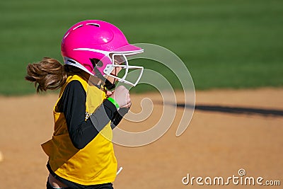 Softball Player Running Looking Surprised at the Play