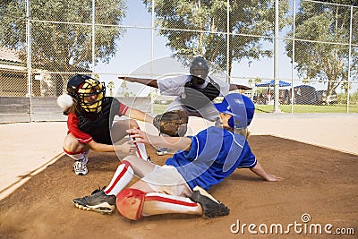 Softball player slideing