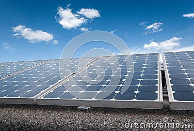 Solar panels over blue sky