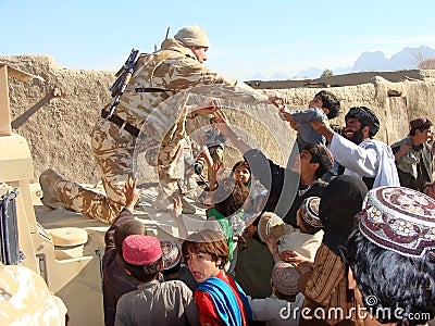 Soldiers bringing help in Afghanistan