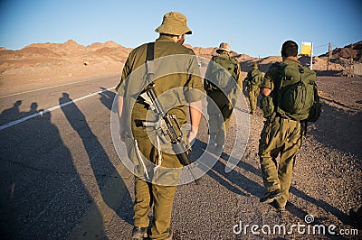 Soldiers patrol in desert