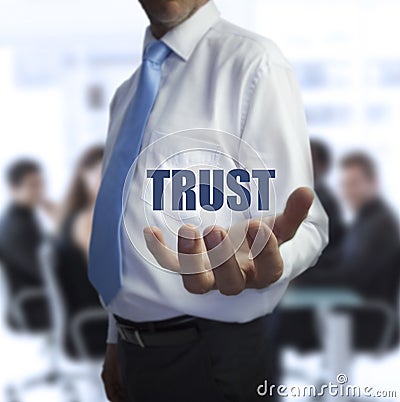Sophisticated businessman holding the word trust