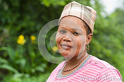 South African Zulu woman wearing traditional mud sunscreen