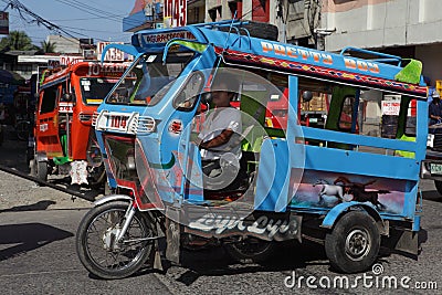 Southeast-Asian motorela on street