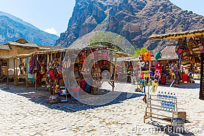 Souvenir market on street of Ollantaytambo,Peru,South America. Colorful blanket, cap, scarf, cloth, ponchos