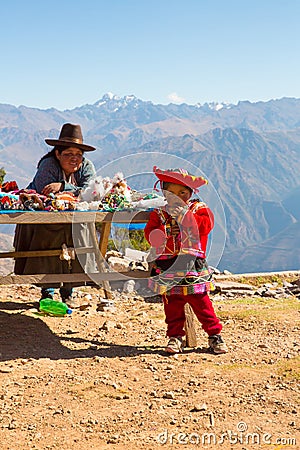 Souvenir market on street of Ollantaytambo,Peru,South America. Colorful blanket, cap, scarf, cloth, ponchos