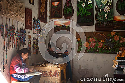 Souvenirs made of wood from handmade shop in Dayan old town.