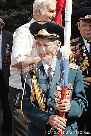Soviet Army veteran with flag