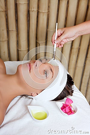 Spa beauty facial treatment oil brush and flowers