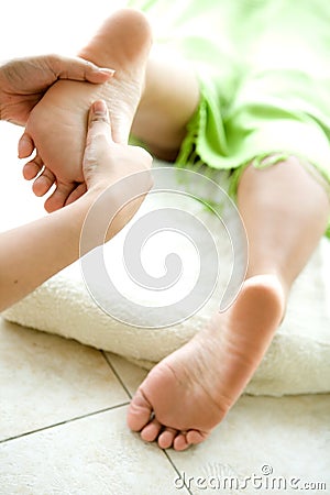 Spa image of feminine foot being massaged