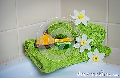 Spa towels with flowers, aroma soap and salt.
