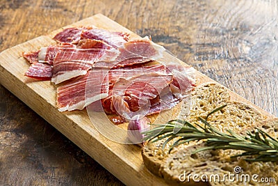 Spanish ham with toasts, focus on ham